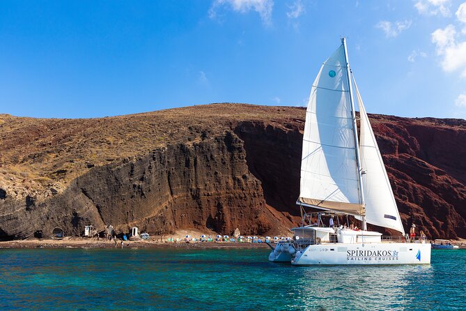 Santorini Private Catamaran Cruise with BBQ, Open Bar & Transfers - A private view of Santorini from Vlychada