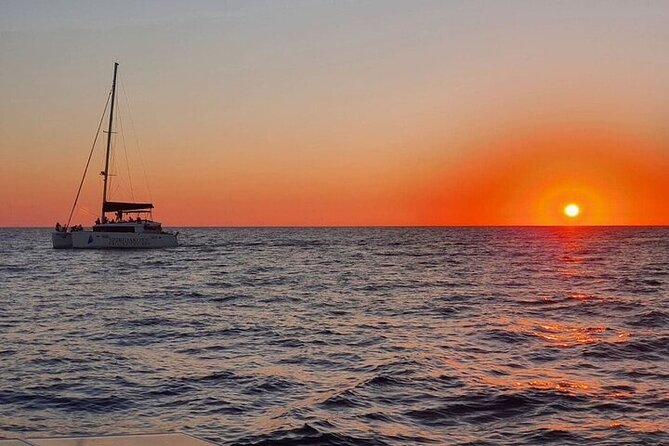 Santorini Private Catamaran Cruise with BBQ, Open Bar & Transfers - Indian Rocks, cliff villages, and the volcano