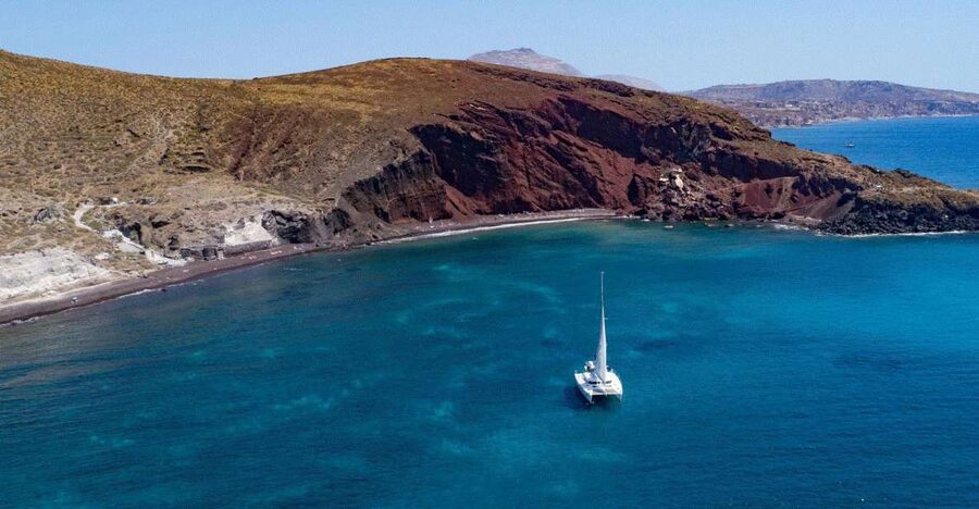 Santorini: Private Day Cruise with a BBQ meal and Open Bar - Red Beach, White Beach, and Black Mountain Beach