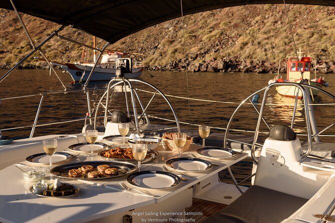 Santorini Private Daytime Sailing Cruise with Meal, Drinks &Transfer included - Passing Thirasia and Aspronisi on the return