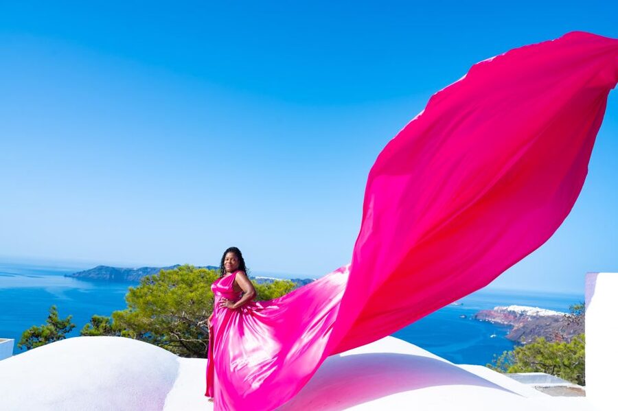 Santorini: Private Flying Dress Photoshoot with Pickup - Oia: the most recognizable first stop
