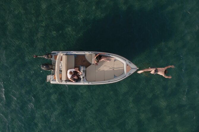 Santorini Rent a Boat - License free private cruise - Five hours of swimming, sun, and open water