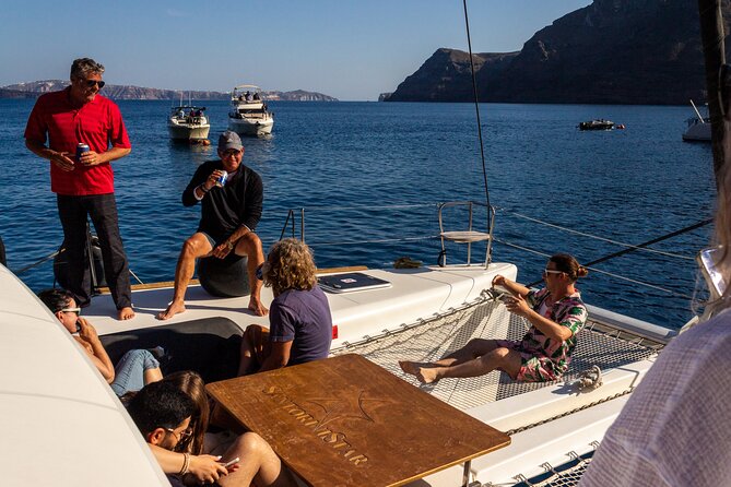 Santorini Sailing Catamaran Daily Cruises w/ Greek BBQ @Thirasia - The volcano coast and warm-water stop