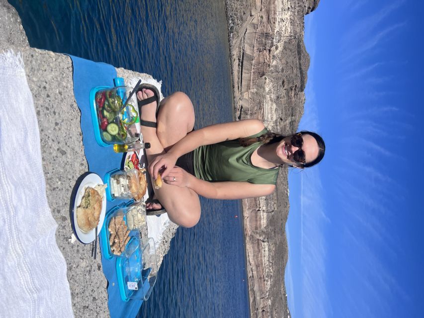 Santorini: Sea Caves Kayak Trip with Snorkeling and Picnic - Entering the caves near Black Mountain