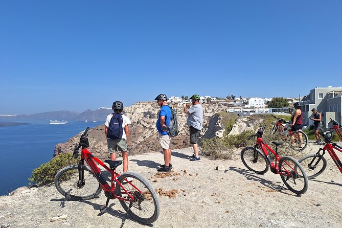 Santorini Small Group Guided E-bike Tour & Local Tomato Museum - Riding through basket-shaped vineyards