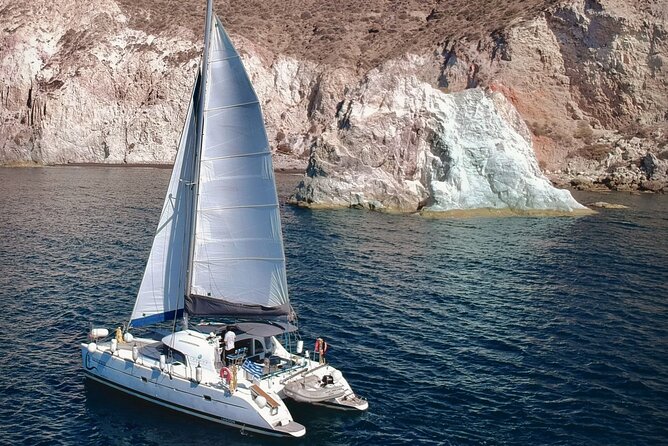 Santorini: Standard Small-Group Catamaran Cruise with Food/Drinks - Red Beach: dramatic cliffs and a short swim
