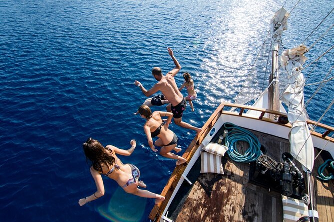 Santorini Sunset Dinner Cruise Including Nea Kameni Visit - From your hotel to Santorini’s caldera