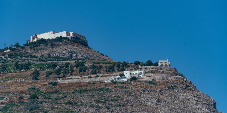 Santorini: Sunset Guided Tour with Hotel Pickup - The Three Bells of Fira and the postcard photograph