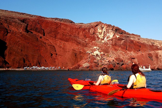 Santorini: Sunset Sea Kayak with Light Dinner with Pick-up Option - A Greek dinner after the kayaking