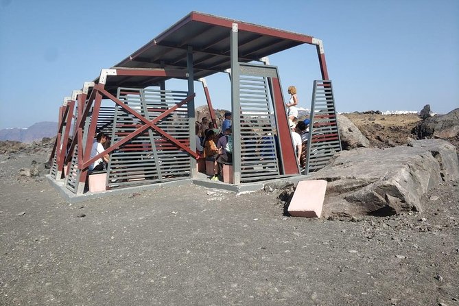 Santorini Volcanic Islands Cruise: Volcano, Hot Springs and Thirassia - A traditional boat, a large group, and onboard extras