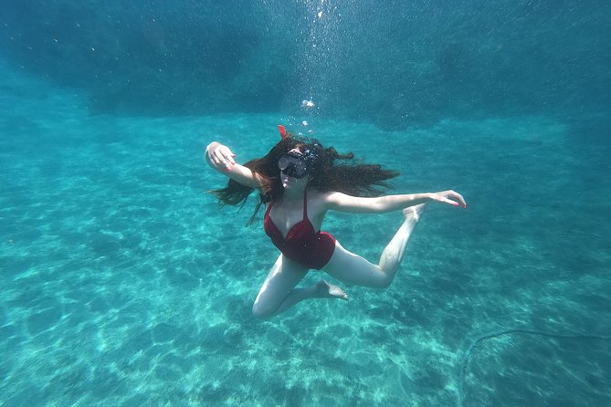 Serenity Kayak : Sea Caves Kayak Trip with Snorkeling & Picnic - White Beach adds an optional burst of adrenaline