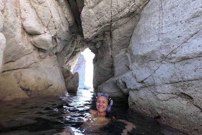 Small-Group Santorini Sea Caves Kayak Trip with Snorkeling & Picnic - Sea caves where sunlight turns the water blue