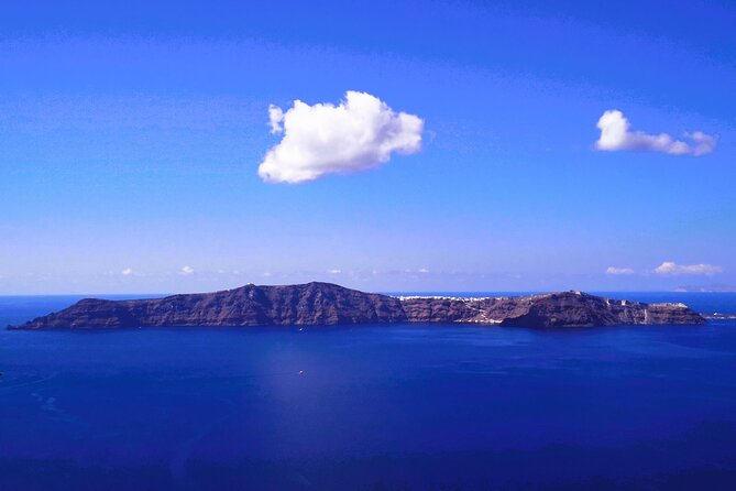 Smooth and Fun Taste of Santorini Private Tour - Monolithos Beach: black sand, sea air, and lunch