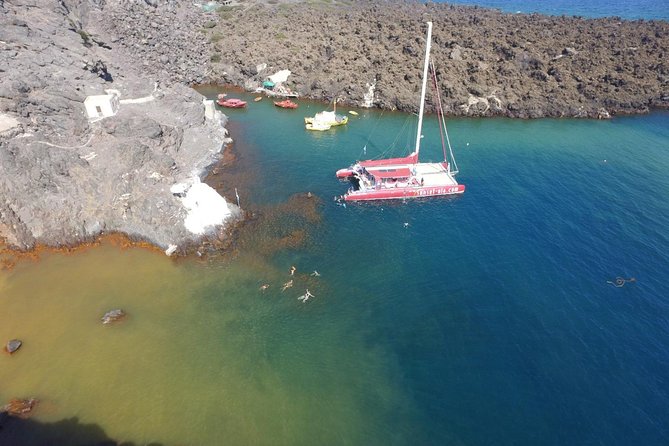Sunset Sailing Catamaran Cruise in Santorini with BBQ and Drinks - White Beach, swimming, and the BBQ