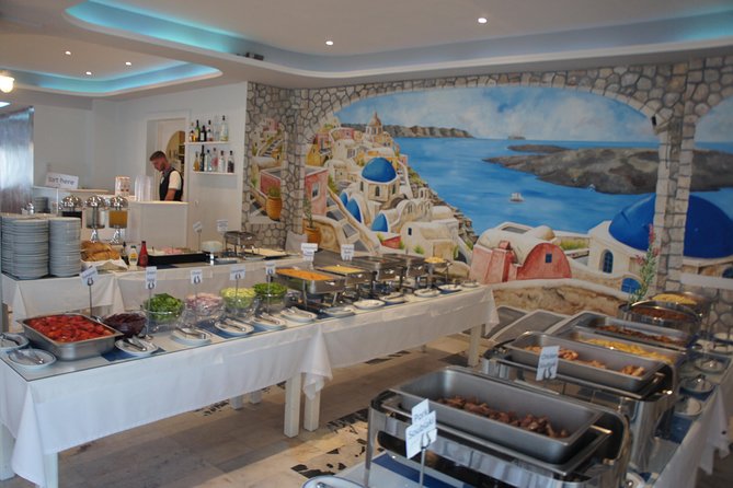 Traditional Greek Night live Music & Dinner Show in Santorini - Plate smashing and audience participation